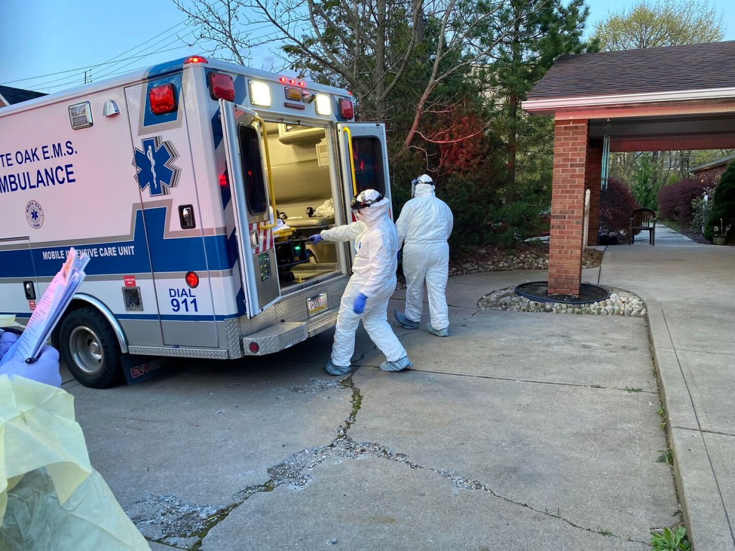 White Oak EMS crew loading equipment at an ambulance